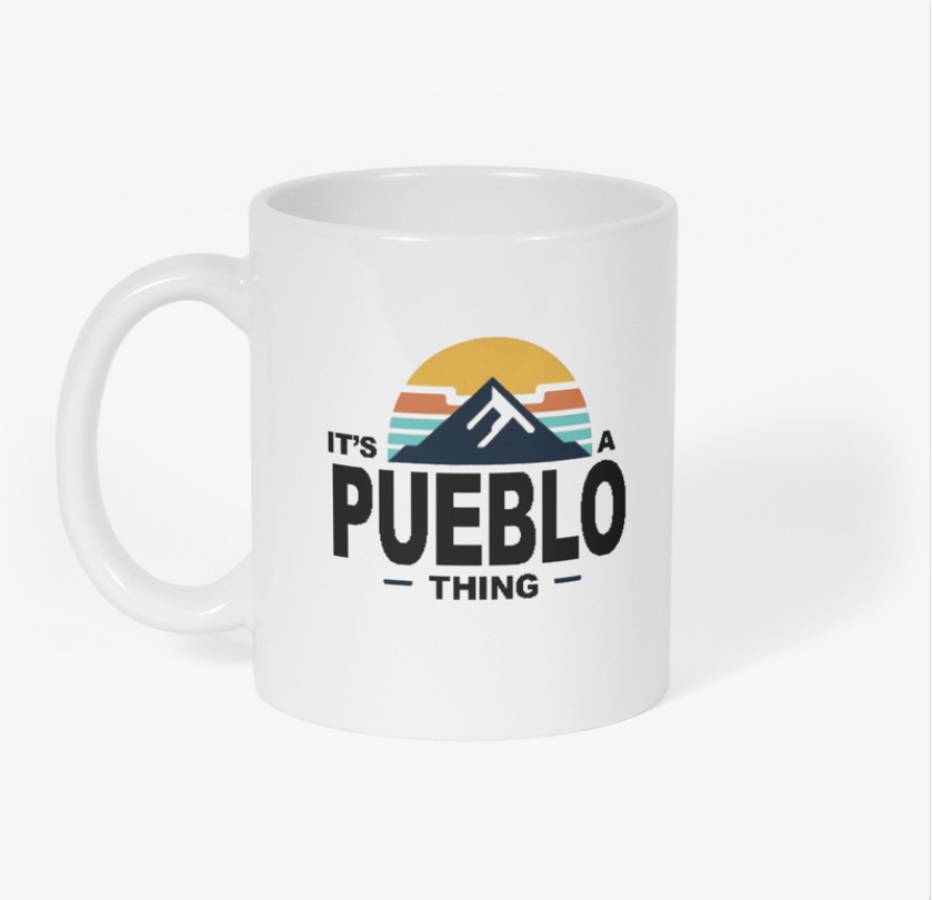 White mug with It's a Pueblo Thing logo including Pueblo, Colorado logo colors
